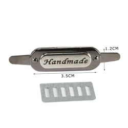 Etichette in metallo ovale con scritta “Handmade” per creazioni artigianali 2