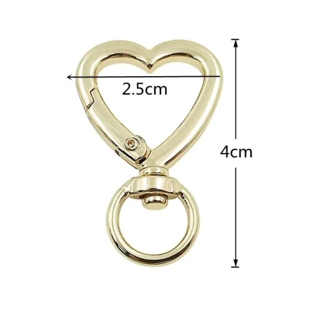 Heart-shaped gold metal snap hooks, elegance and functionality for bags and accessories
