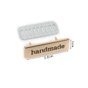 Gold metal labels with ‘Handmade’ lettering for bags and creative sewing