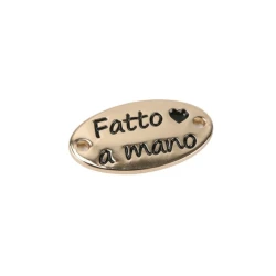 Sew-on metal “Fatto a Mano” tag in gold and silver finishes 2