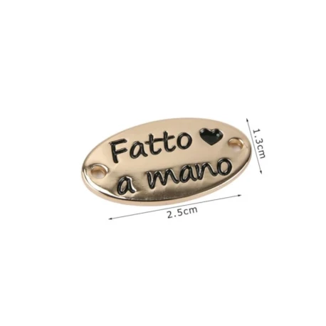 Etichetta in metallo da cucire “Fatto a Mano” oro/argento