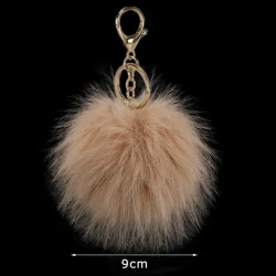 Ciondolo borsa e portachiavi Pom Pom 9 cm eco pelliccia oro