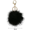 Ciondolo borsa e portachiavi Pom Pom 9 cm eco pelliccia oro