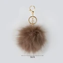 Ciondolo borsa e portachiavi Pom Pom 9 cm eco pelliccia oro