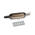 Oval metal labels with the inscription 'Handmade' for handicraft creations